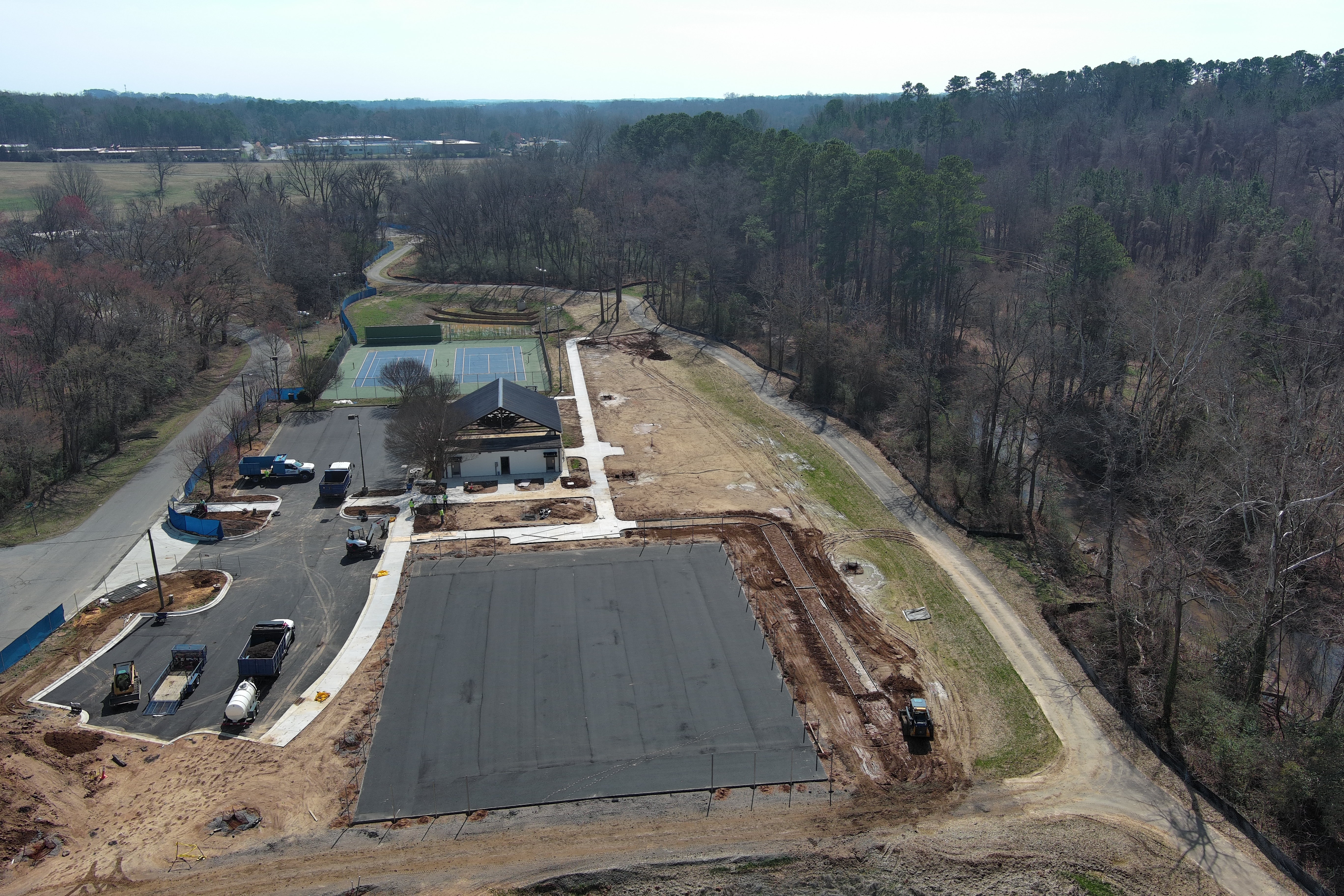 Overview image of the newly paved parking lot and basketball courts